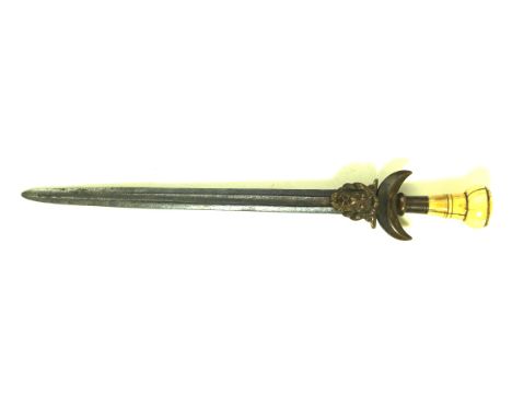 A Far Eastern dagger/paper knife, late 19th Century28cm double edged single fullered blade, crescent shaped cross guard with 