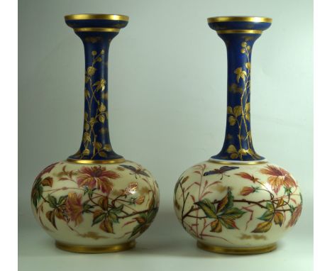 A pair of Victorian hand-painted opaque glass vases of bulbous formEach with cylindrical necks decorated with flowers and ins