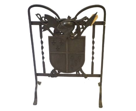 A Period-style cast and wrought iron firescreen, early 20th CenturyDecorated with a shield, arms and armor, raised on four ou