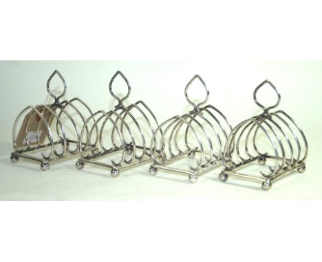 A set of four Edward VII hallmark silver toast racks by William Hutton & Sons LimitedEach of diminutive form with five lancet