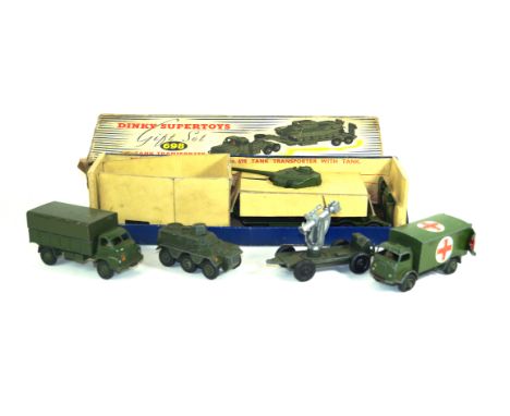One boxed and twelve unboxed diecast military itemsComprising a boxed Dinky Supertoys gift set no. 698 tank transporter with 