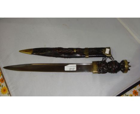 Late 18th century Scottish dirk with brass knop pommel, carved Celtic knot handle, in leather scabbard with fork blade &amp; 