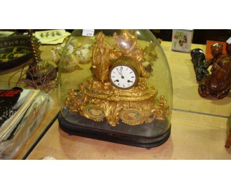 Late 19th over painted ormolu continental mantle clock modelled with lady in glass dome