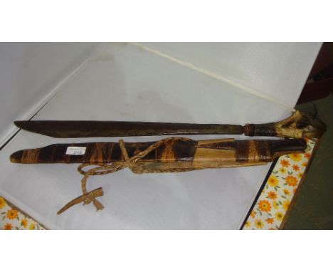 Late 19th / early 20th century Dayak mandau with single edged weighted blade inlaid with copper carved antler handle with som