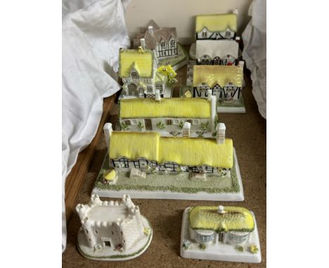A Coalport porcelain model of The Village shop together with other Coalport cottages including The Keep, Anne Hathaway's Cott