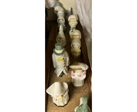 A collection of Royal Worcester candle snuffers including Mob Cap, Mrs Caudle, Owl, Feathered Hat, Mr Caudle, Punch etc 