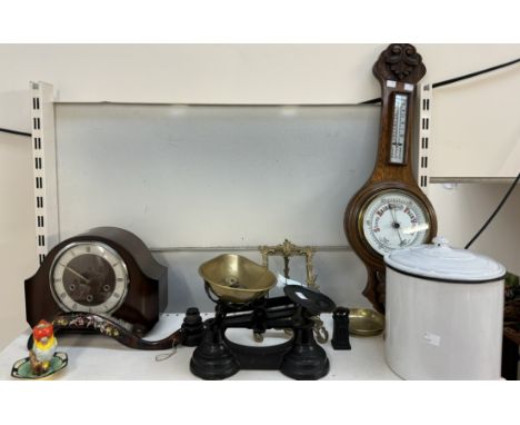 A carved oak barometer together with a mantle clock, scales, enamel pot and cover, photo frame etc 