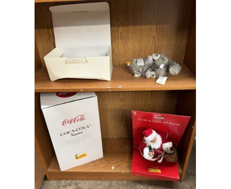 A Steiff Coca Cola Santa together with a Steiff cat, boxed 