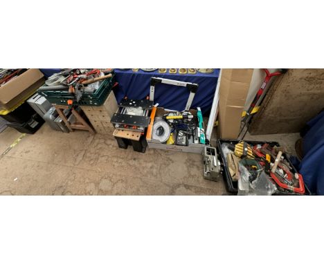 A large collection of tools including clamps, spirit level, battery charger, brushes, hammers, work benches, bolsters, toolbo