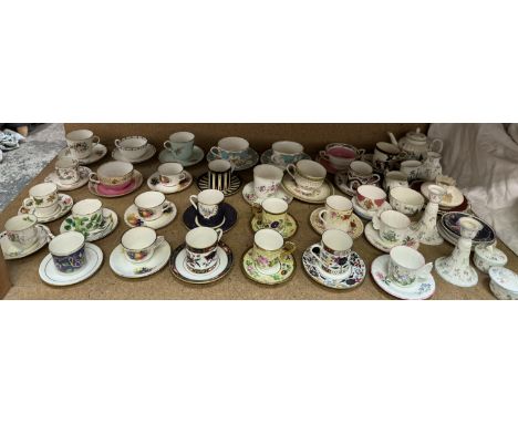 A large collection of Royal Worcester cabinet cups and saucers, including Enchantment pattern, Worcester Fruit, Prince Regent