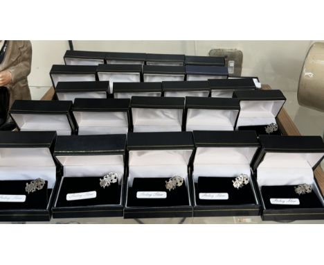 Twenty Three silver lapel badges depicting the Welsh Dragon and Celtic Cross