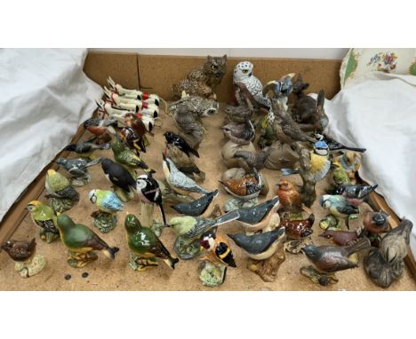 A collection of Beswick, Poole pottery and R J Mack, bird and animal models together with three Muffin the Mule puppets