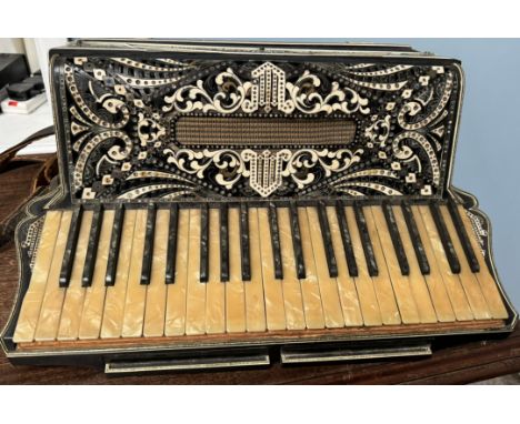A piano accordion with 64 mother of pearl keys and buttons, by Ranco Antonio and sons