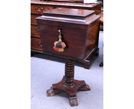 A William IV Mahogany Cellaret on Stand, of caddy form and with gadrooning, supported by a boldly turned upright on a waisted