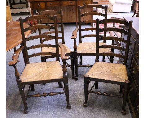 A Set of Four Ladder Back and Rush Seated Dining Chairs, including two carvers 