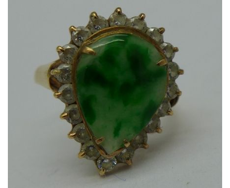 An 18ct gold, green and white stone ring, 2.8g, K