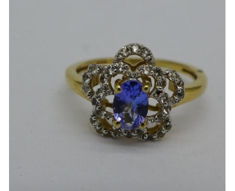 A silver gilt, tanzanite and white topaz cluster ring, P