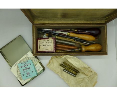 A collection of leather working tools