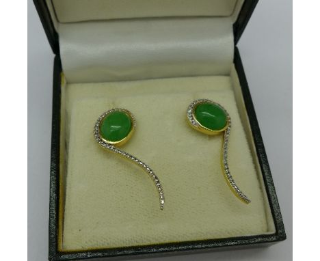 A pair of silver gilt and jade earrings set with diamond accents