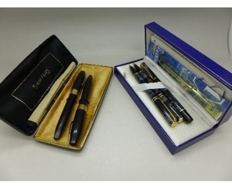 A pair of Sheaffer pens both with 14k nibs, boxed and a Waterman pen set, boxed