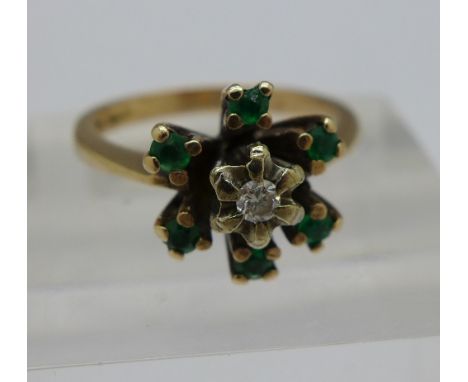 A 9ct gold, diamond and green stone cluster ring, 3.8g, N