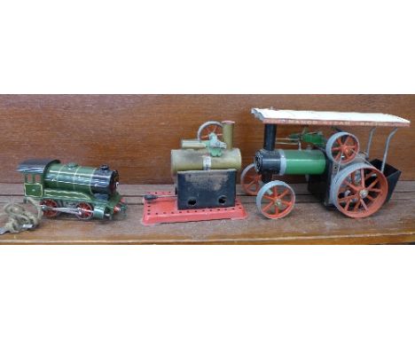 A Mamod steam tractor, TE1A, a Mamod static steam engine and a Hornby clockwork O gauge model engine