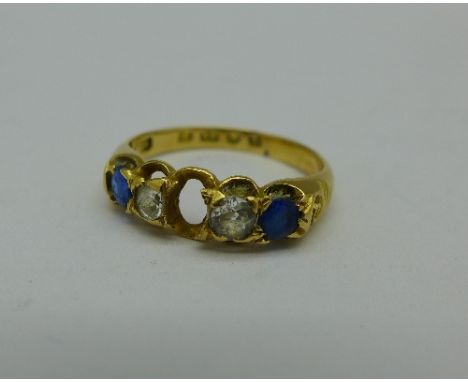 An 18ct gold ring set with a diamond, two blue stones and a white stone, lacking one stone, 2.8g, L