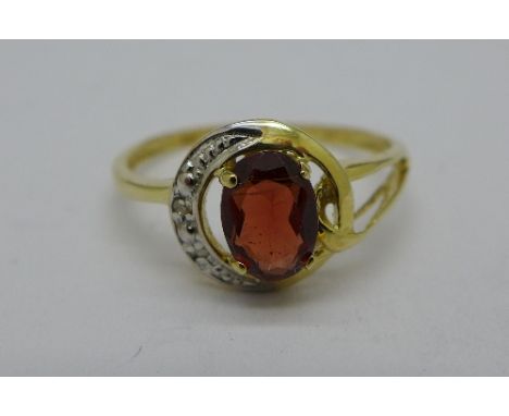 A 9ct gold, red stone and diamond ring, 1.3g, O