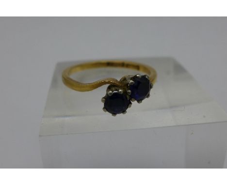 An 18ct gold and crossover sapphire ring, 2.3g, M