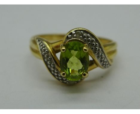 A 9ct gold, peridot and diamond ring, 2.7g, P