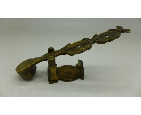 A set of sovereign scales, marked Harrisons