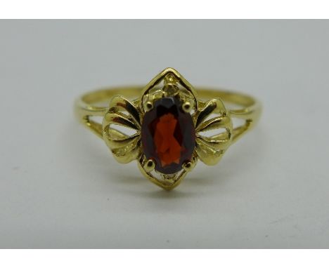 A 9ct gold, red stone and diamond ring, 1g, O