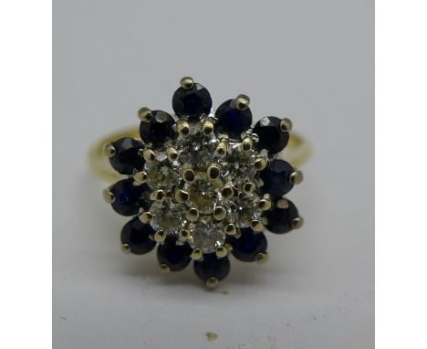 An 18ct gold, sapphire and diamond cluster ring, 3.6g, O