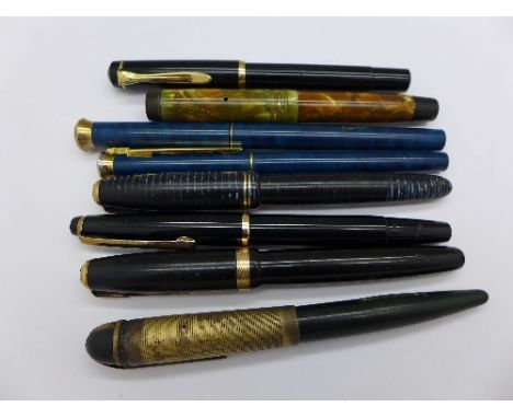 A Parker pen with 18ct nib, a Parker pen with 14k nib, an Eversharp pen with 14ct nib, a Pierre Cardin pen and pencil set and