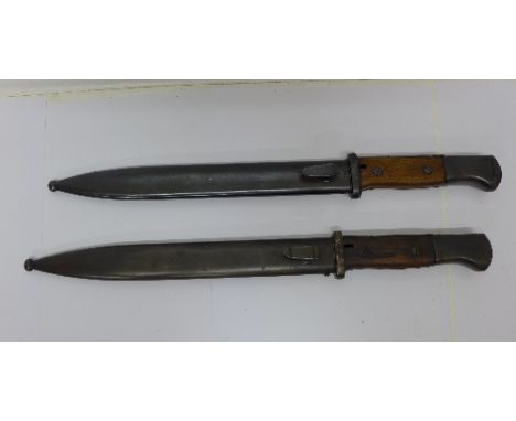 Two bayonets with scabbards, one scabbard marked E.u.f. Hörster 1940
