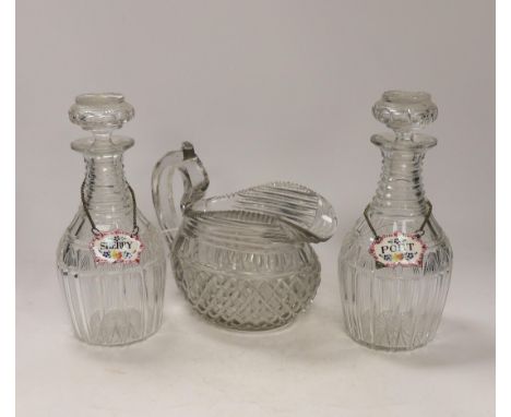 A Regency hobnail and slice cut jug and a pair of Regency cut glass mallet shaped decanters with ‘’Port’’ and ‘’Sherry’’ poly
