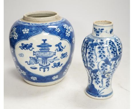 A Chinese Kangxi blue and white jar and a similar vase, jar 19.5cm high. Condition - both cracked and chipped, poor