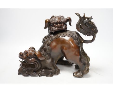 A large Chinese bronze incense burner, modelled as 2 lion dogs playing, 19th century, 22cm high. Condition - good