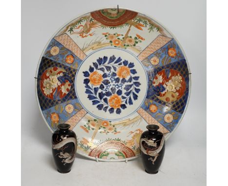 A pair of Japanese cloisonné enamel ‘dragon’ vases and a Japanese Imari dish, 39.5cm diameter (3). Condition - fair to good