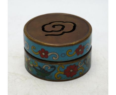 A heavy Chinese cloisonné incense box enamelled with flowers, apocryphal Qianlong mark 8cm in diameter. Condition - fairOne t