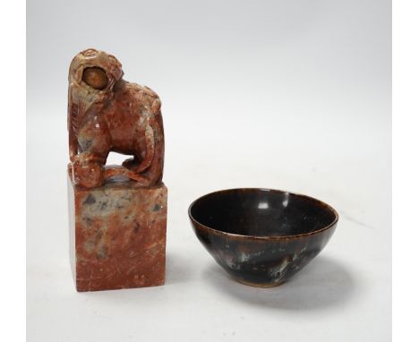 A large Chinese carved soapstone ‘lion dog’ seal and a ‘hares fur’ bowl, largest 17cm. Condition - fair