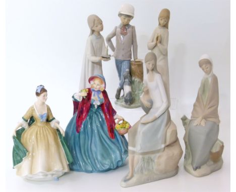 Five NAO figures together with a Royal Doulton figure of Elegance and lady Charmain. Unfortunately we are not doing condition