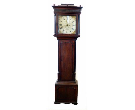 A mid 19th century oak longcase clock by James Topham, Nantwich. With flattened caddy-top pediment and fluted columns framing