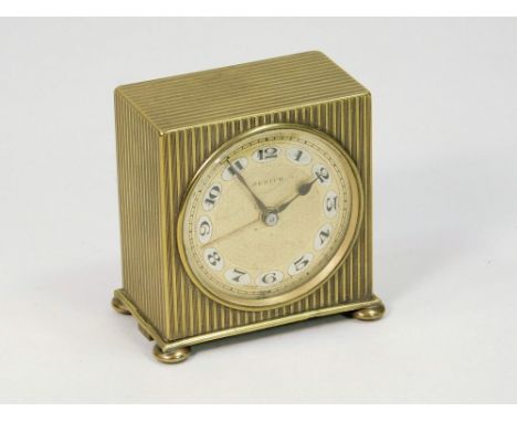 ZENITH CLOCK. A brass cased Zenith dressing table clock. Height 5.5cm.Please note: All watches and clocks are antique, second