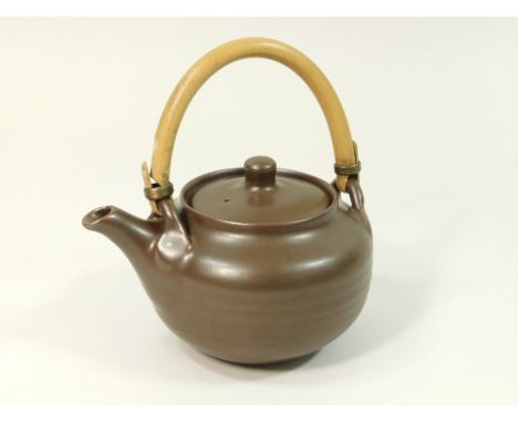 CREWENNA POTTERY, NEW ZEALAND. A Harry & May Davis cane handled, one pint teapot from the first kiln at the Crewenna Pottery.