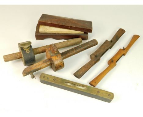 VINTAGE TOOLS. Including a Victorian whetstone in shaped mahogany box, two spoke shaves, one stamped Buck of Whitechapel, two