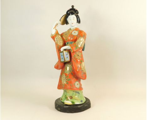 JAPANESE LAMP. A large Japanese figural lamp base on wooden plinth. Full height 70cm.WE CANNOT SHIP THIS ITEM… Due to fragili