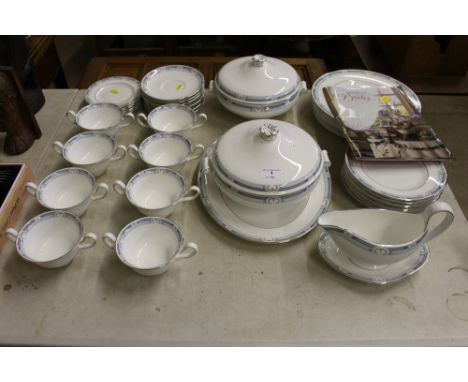 A collection of Wedgwood "Masefield" dinnerware to include tureens, meat plate gravy boat and stand, dinner plates, soup cups