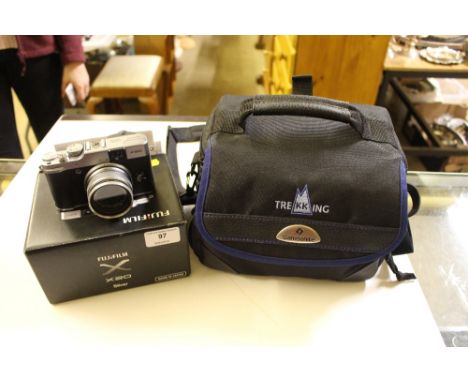 A Fuji Film X20 camera with carrying bag 
