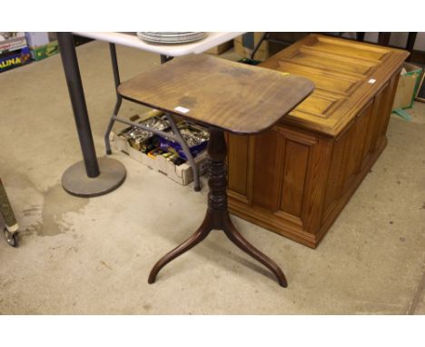 An antique occasional table raised on tripod base and turned column